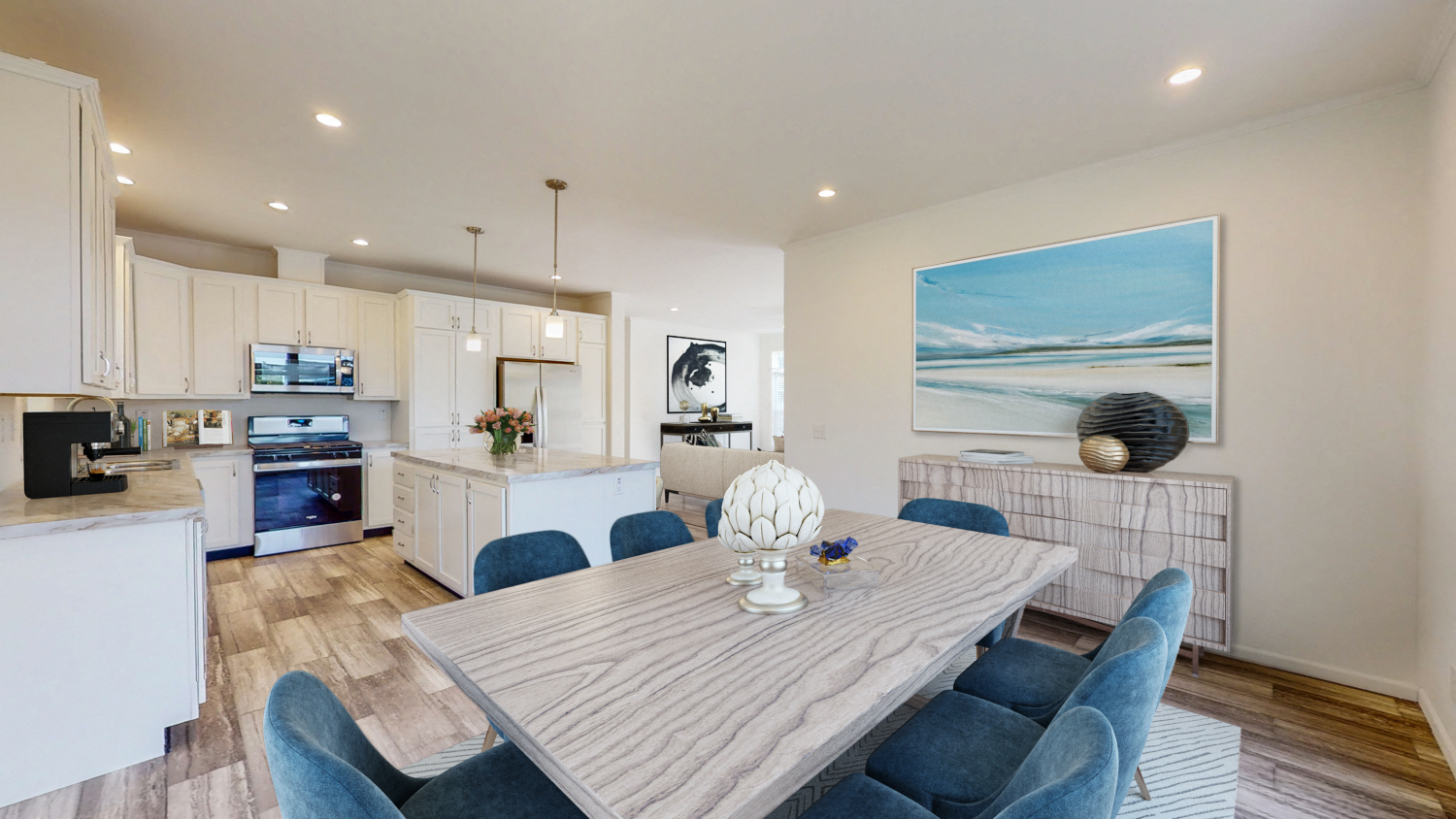 an open kitchen and dining room with a table and chairs