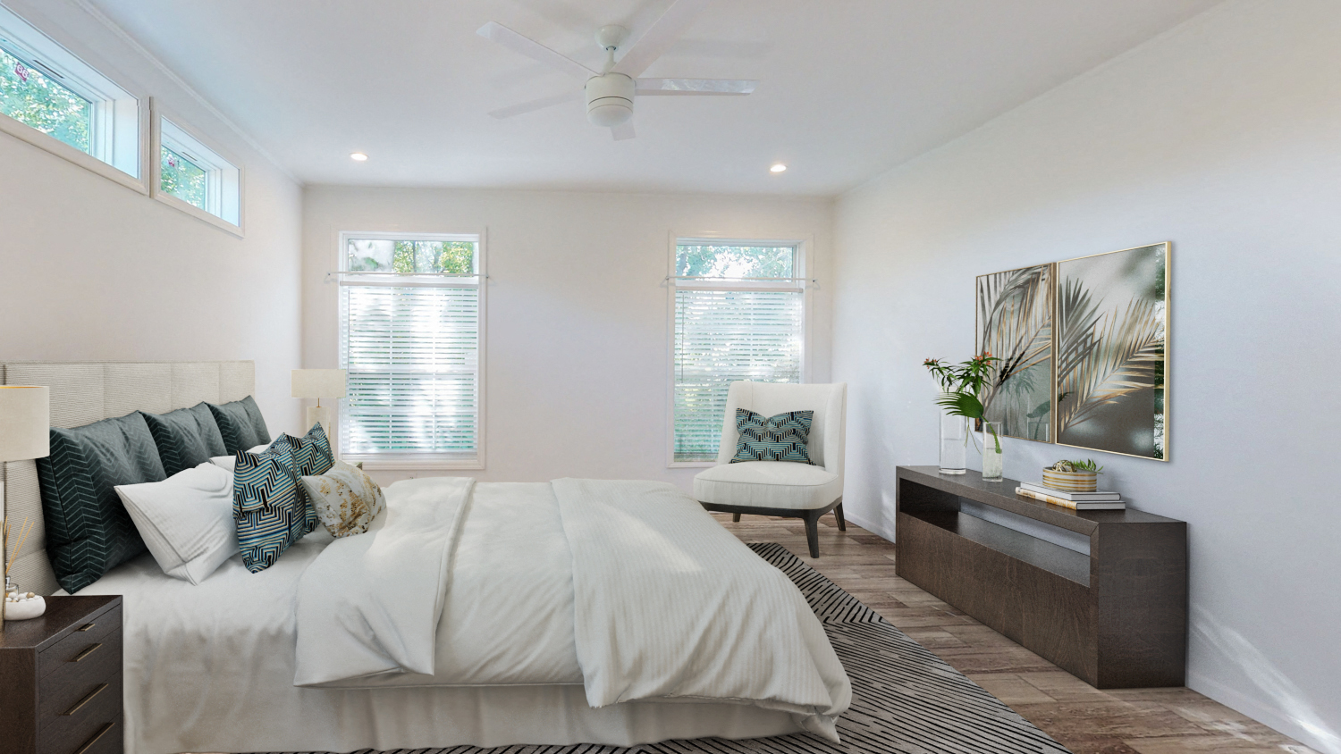 a bedroom with a large bed and a ceiling fan