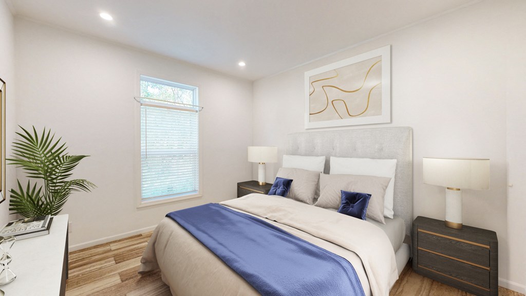 a bedroom with a large bed and a window