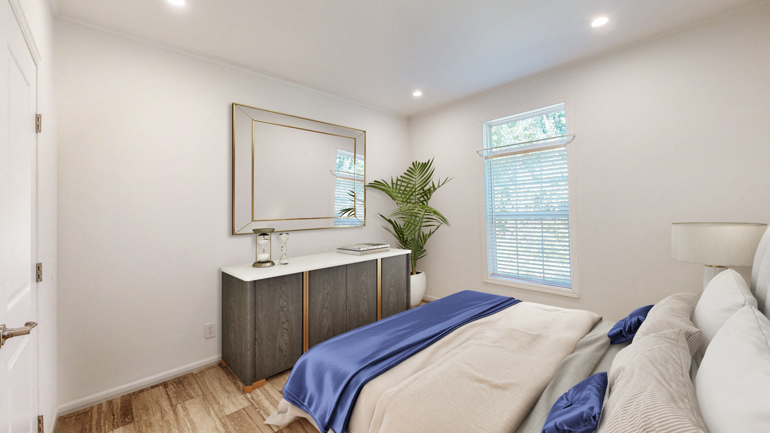 a bedroom with a bed and a dresser with a mirror