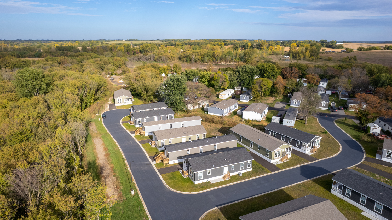 a aerial view of a neighborhood of houses with trees