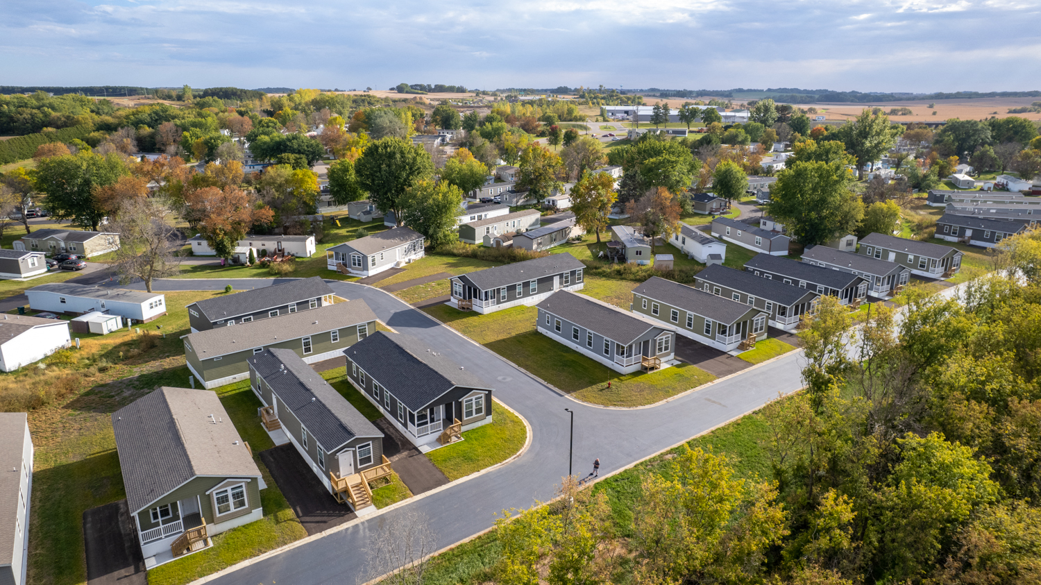 an aerial view of a neighborhood with houses and trees