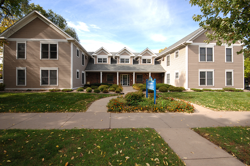an image of a house with a blue sign in front of it