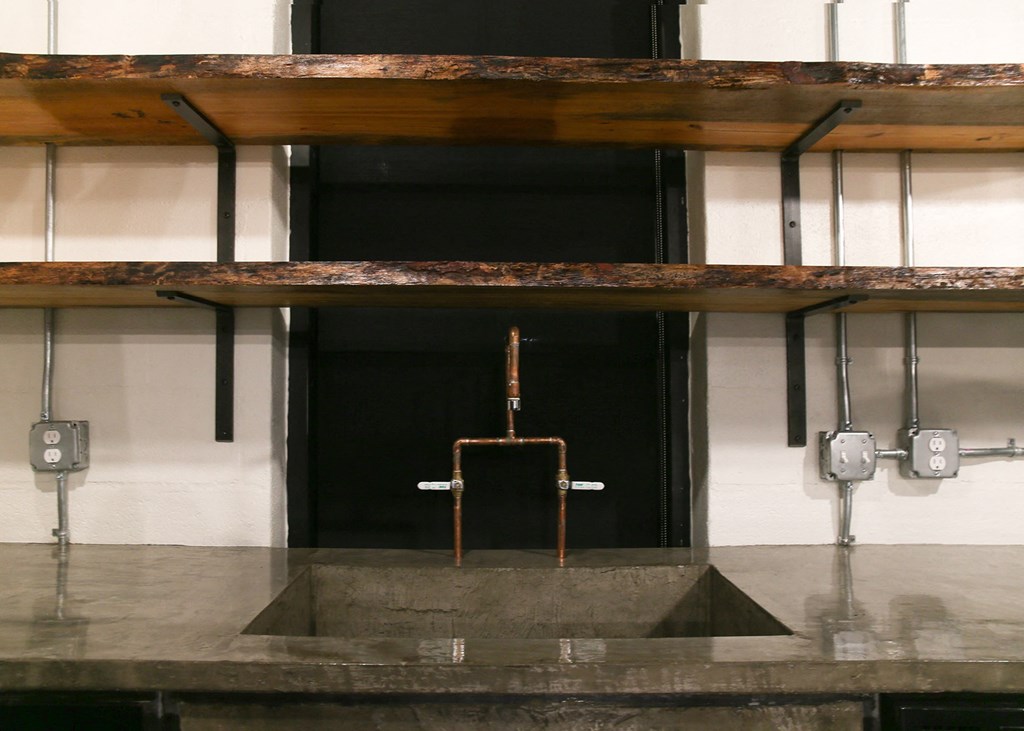 a bathroom with a sink and a urinal in a building