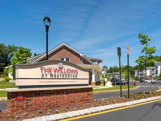 the willows at weaverton sign in front of a building