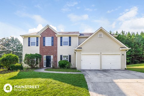 a house with a garage and a lawn