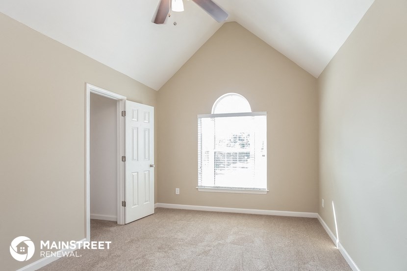 the master bedroom is spacious and clean with vaulted ceilings