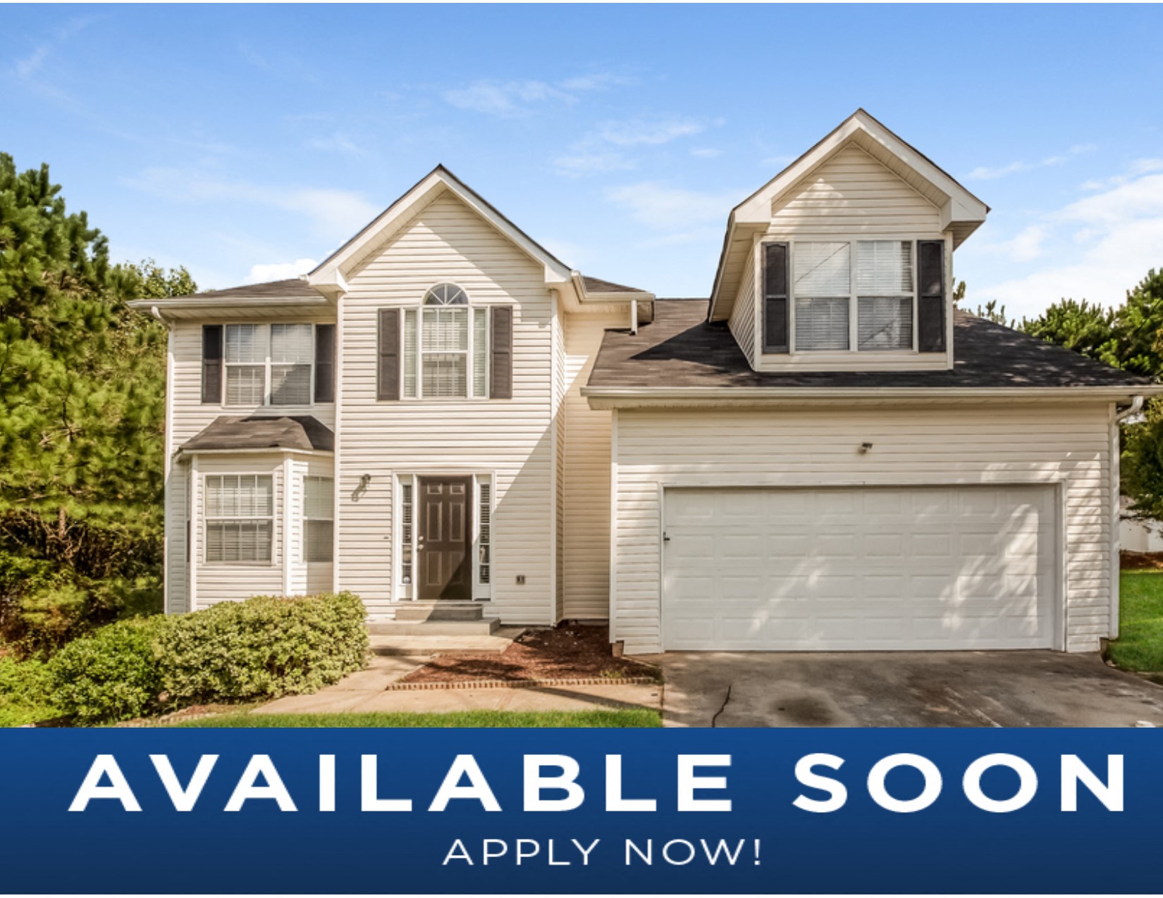 a beige and white house with a garage door