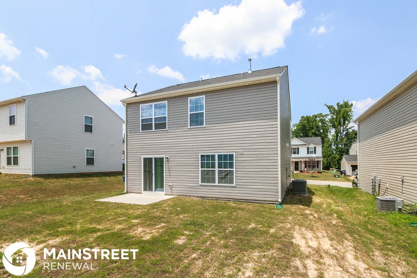 a renovated home with a and a grassy yard