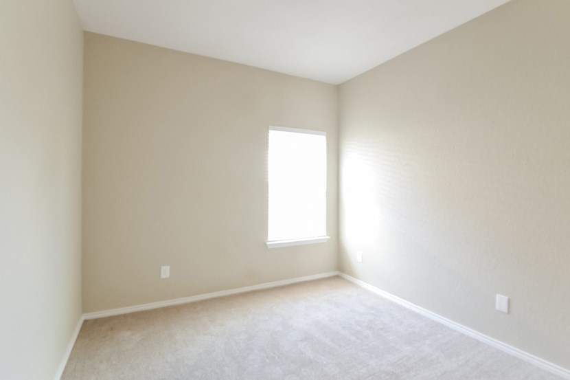 an empty room with a window in it