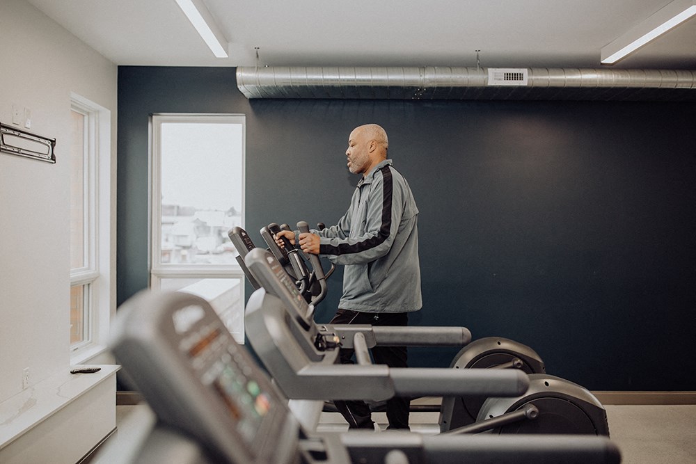 a man working out on an exercise bike in a gym