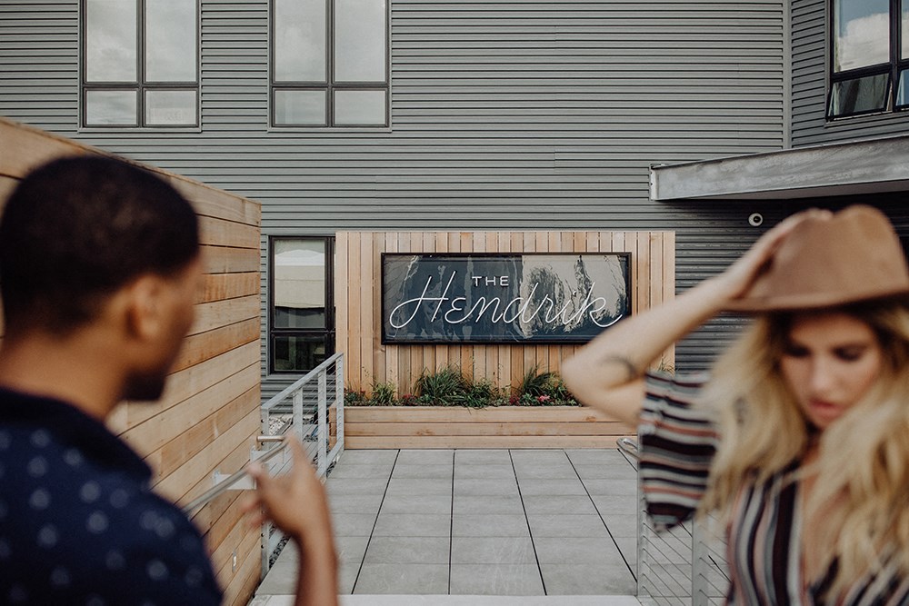 a couple of people standing in front of a building