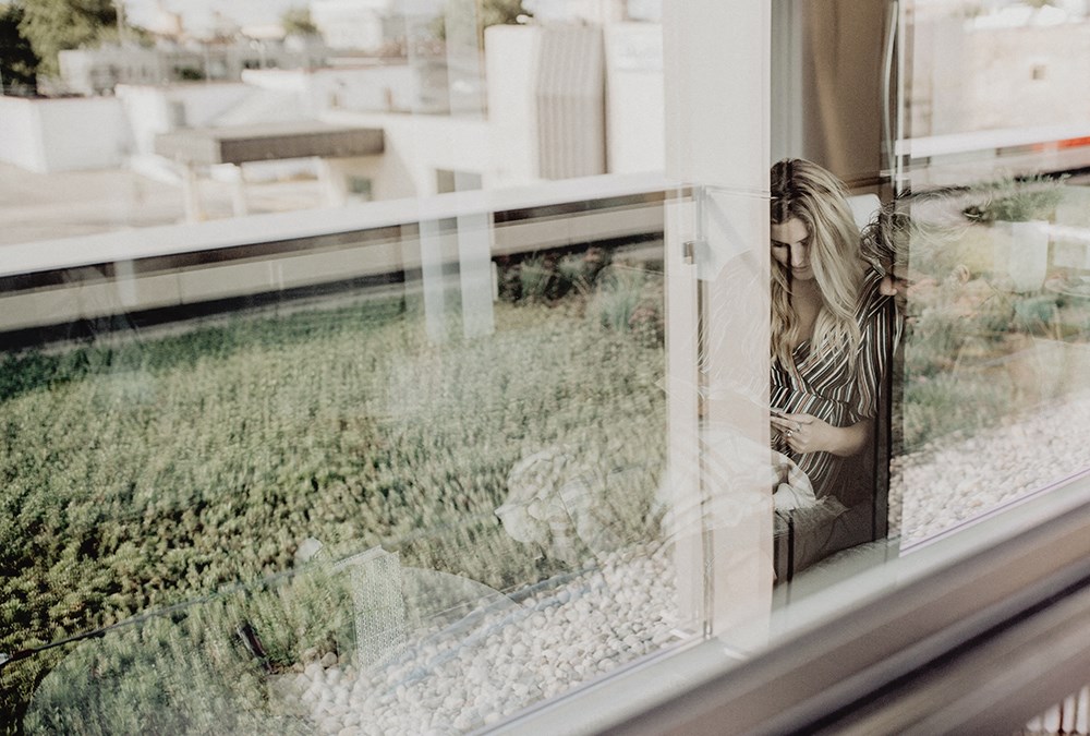 a reflection of a woman in a window