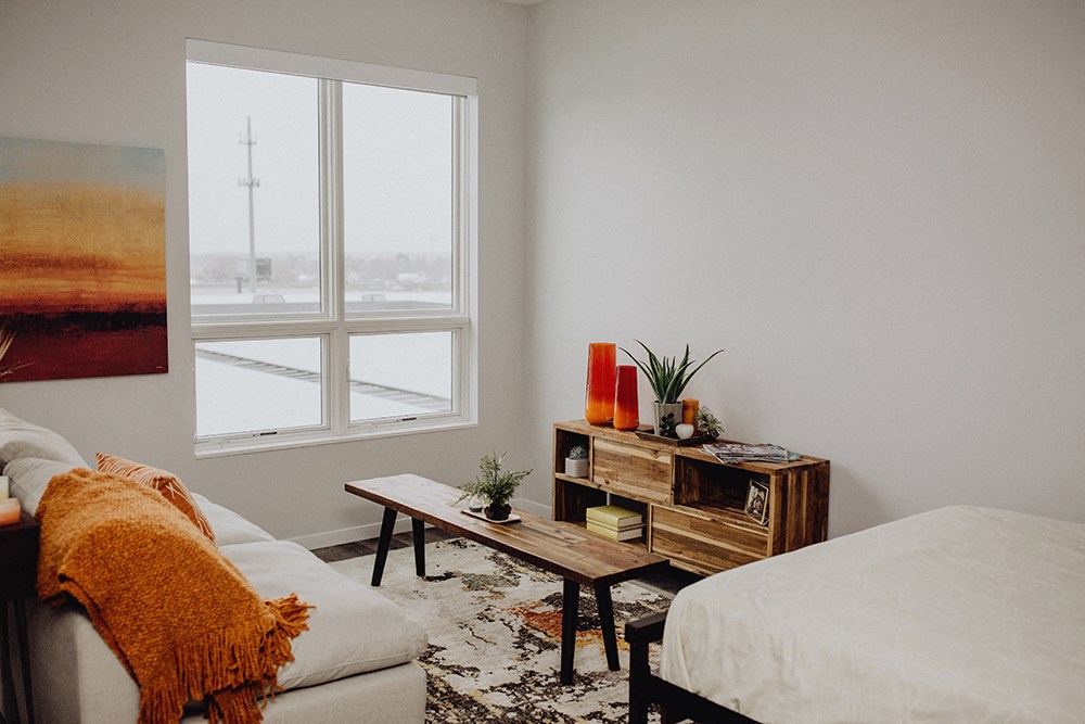 a living room with a couch and a window