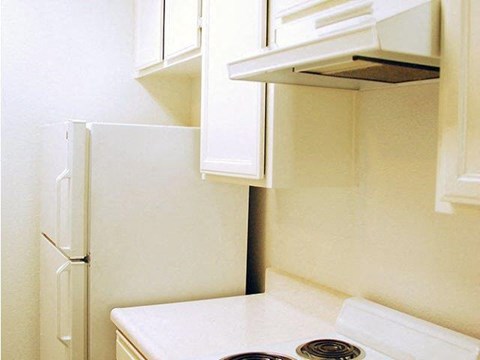 A white refrigerator is in a kitchen.