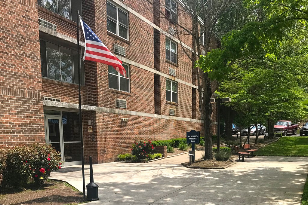 an flag in front of a brick building