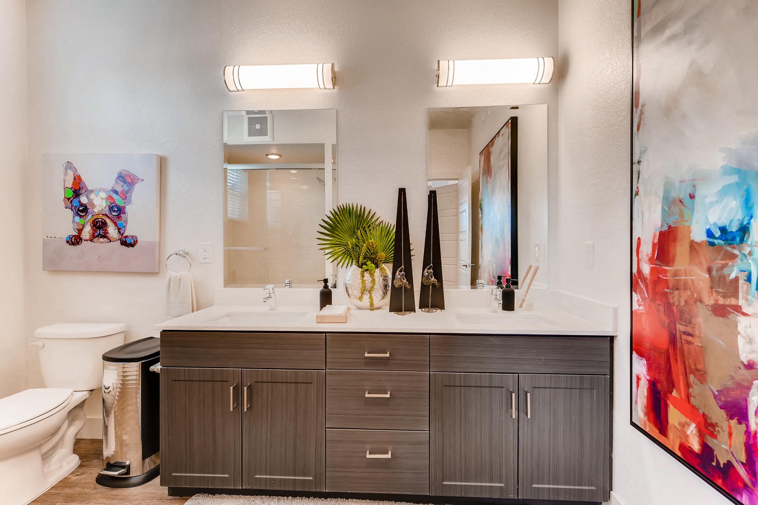 a bathroom with a sink and a mirror and a toilet