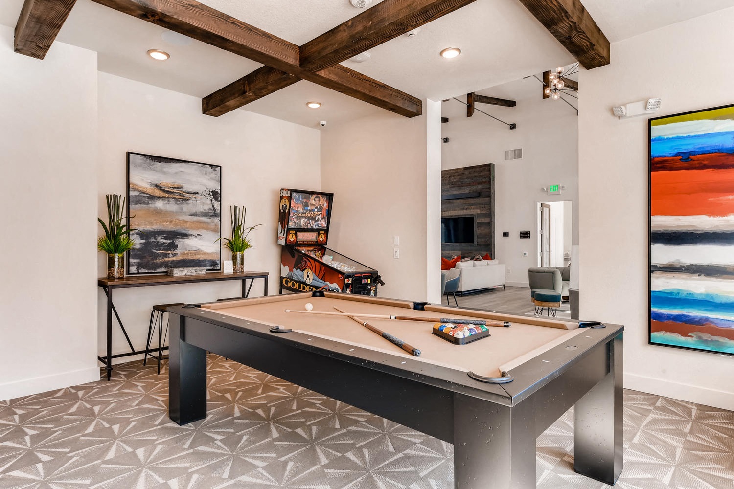 play a game of pool in the clubhouse at the estates run apartments