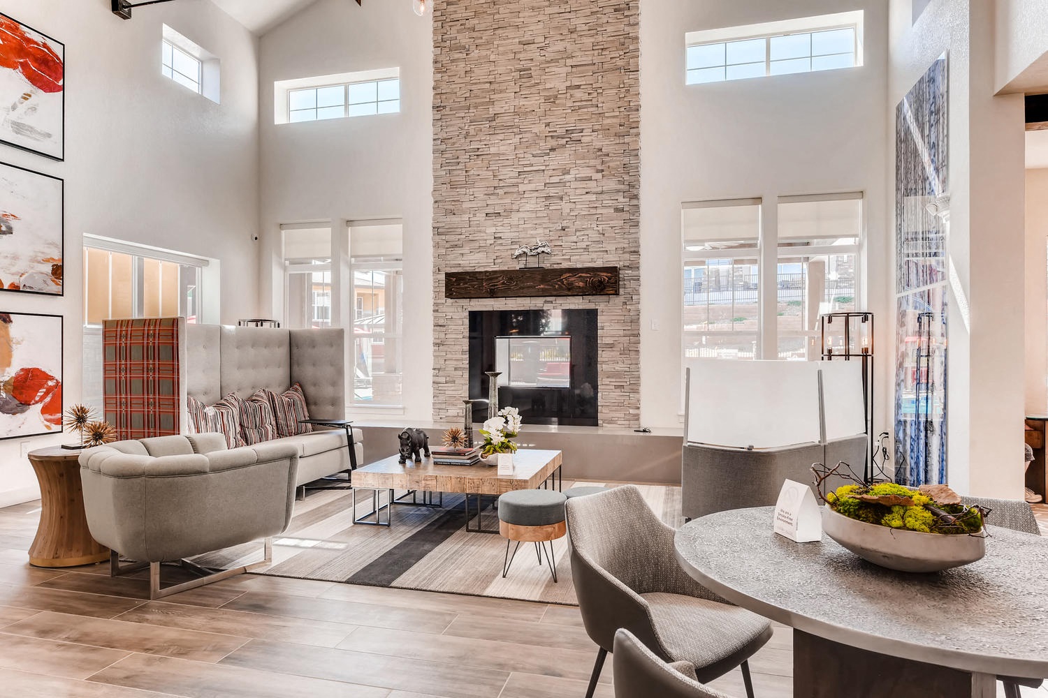 a living room with couches and chairs and a fireplace