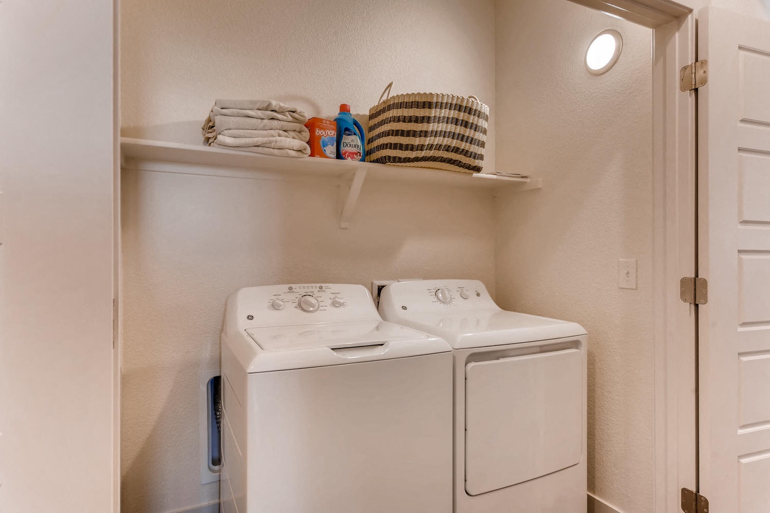 the washer and dryer in the laundry room of a home