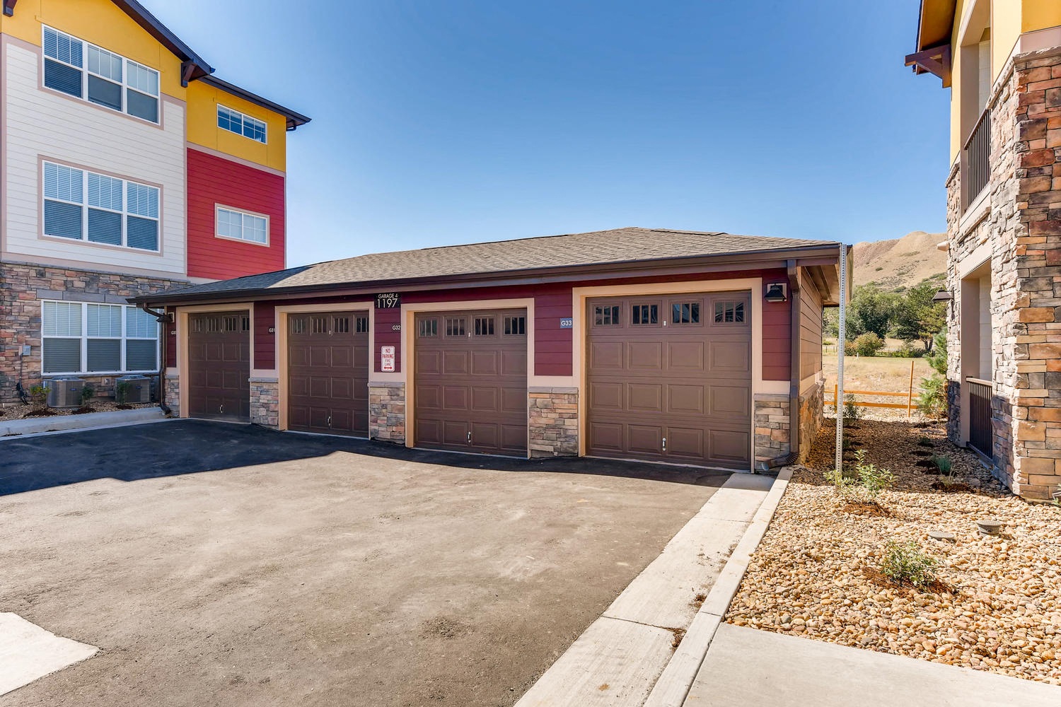the garage of a house with two brown garage doors