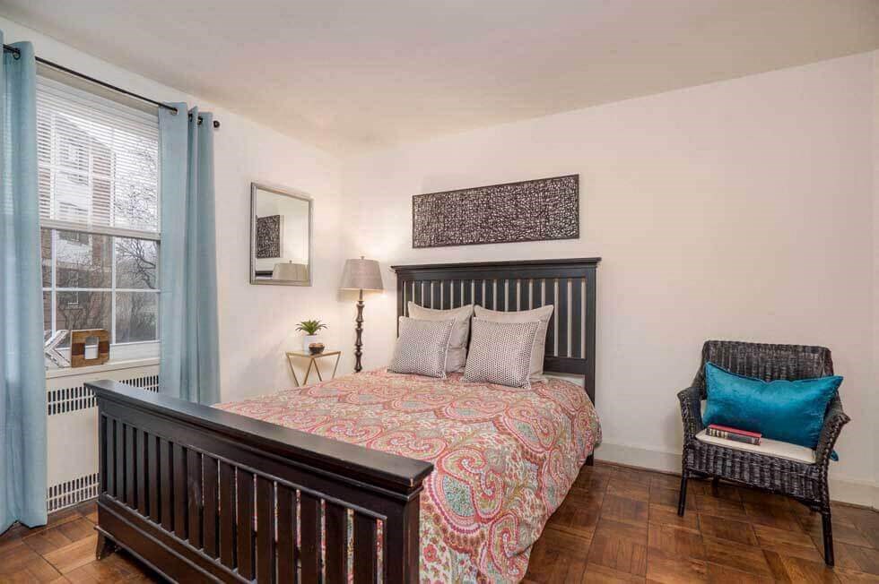 a bedroom with a bed and a window