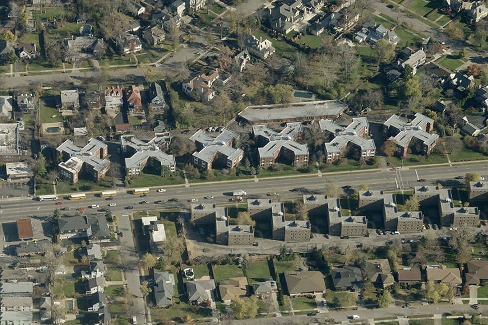 an aerial view of houses and a highway