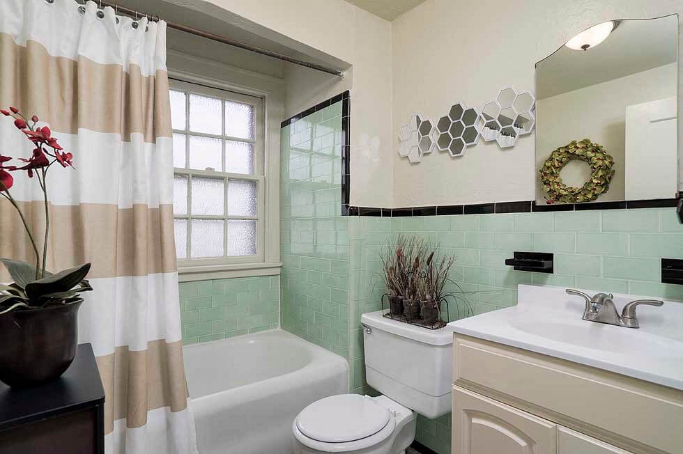 a bathroom with a sink toilet and a bath tub
