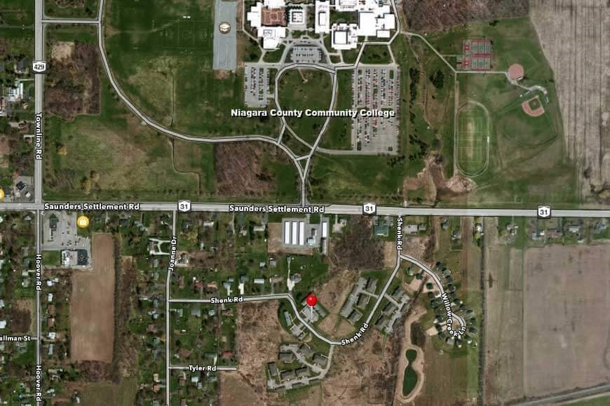 a map of the campus and a street with a red stop sign