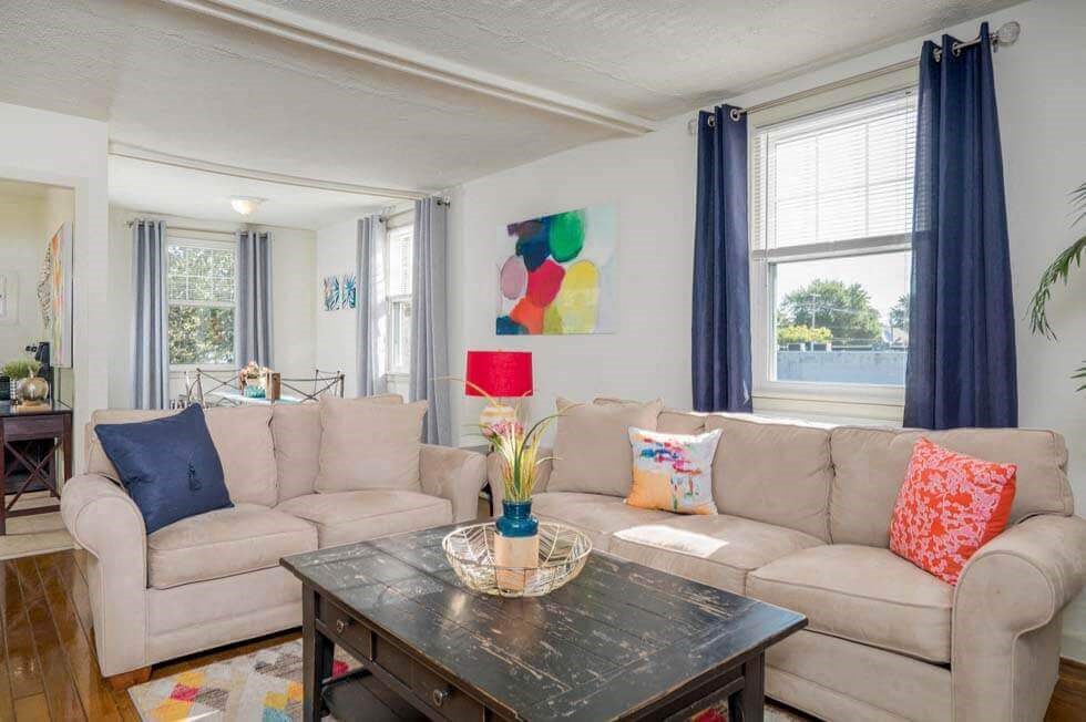 a living room with two couches and a table