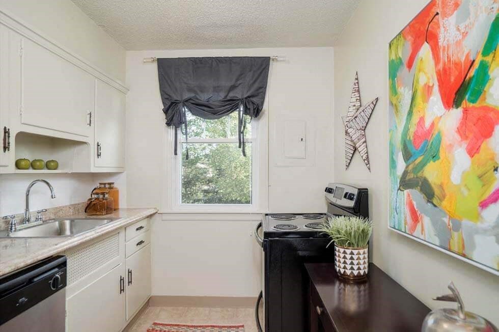 a small kitchen with a sink and a window
