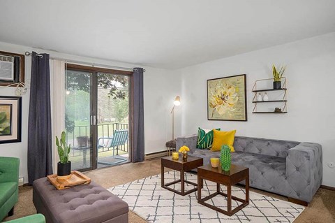 a living room with a couch and a sliding glass door