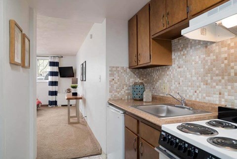 a small kitchen with a stove and a sink