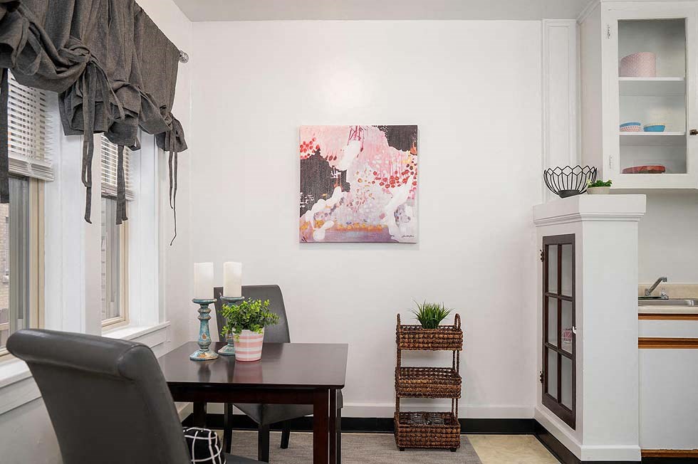 a dining room with a table and a chair