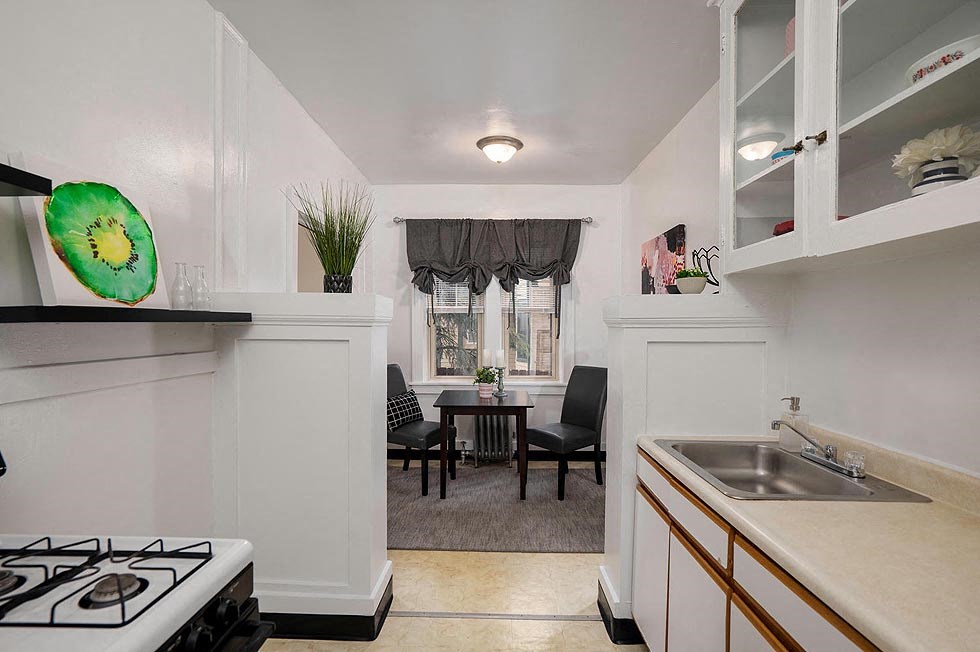 a kitchen with a stove and a sink