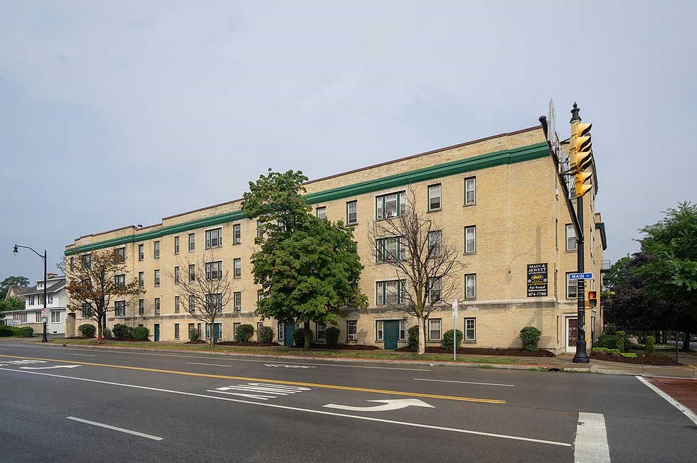 a large building on the corner of a street
