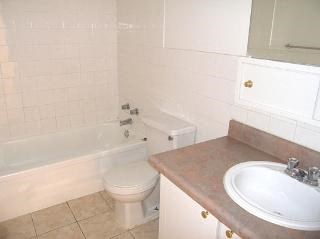 a bathroom with a sink toilet and a bath tub