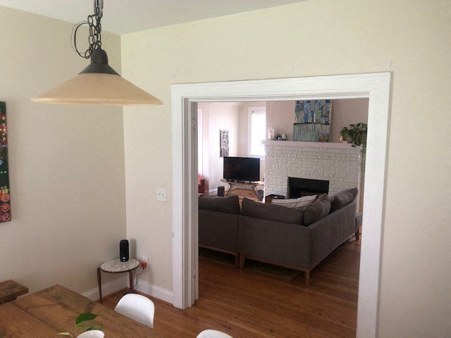 a living room with a couch and a fireplace