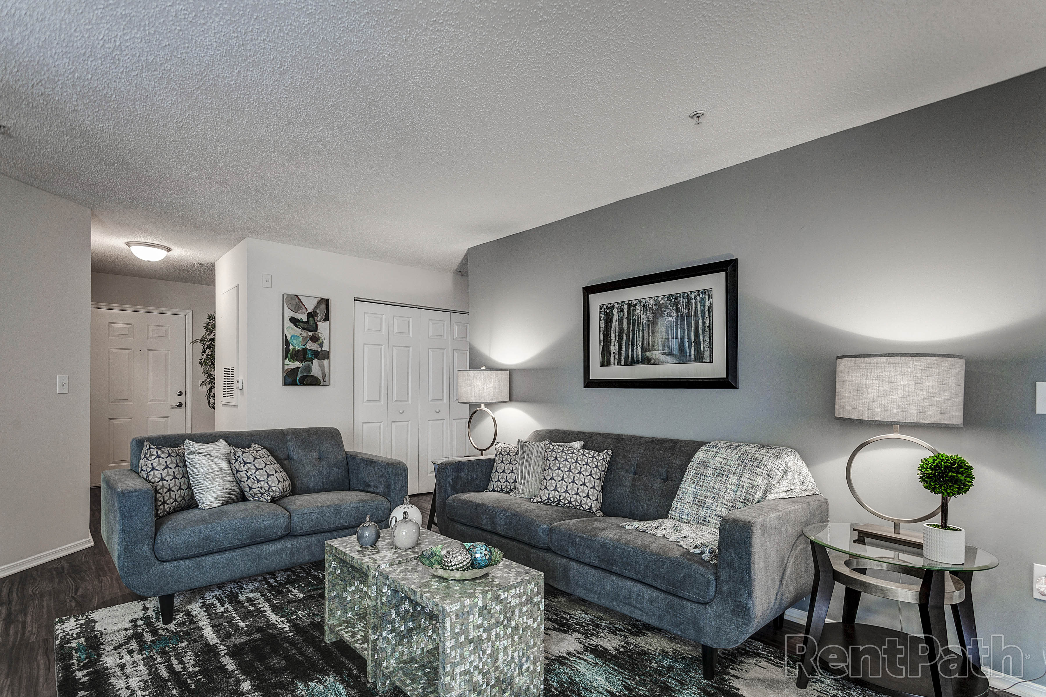 our apartments offer a living room with couches and a coffee table