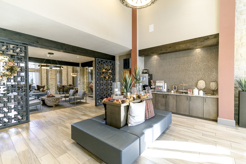 a lobby with a couch and a counter with food on it