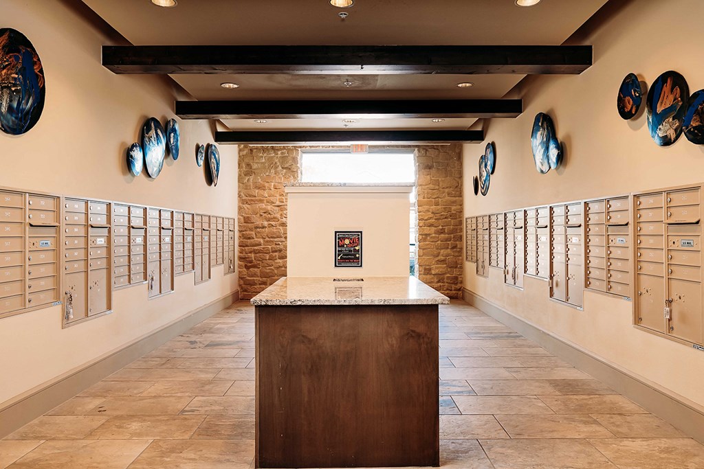 a tasting room with wine glasses on the wall and a counter top