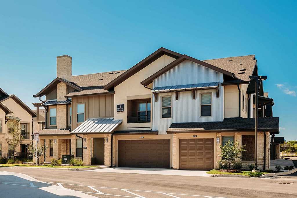 a house with a driveway and a garage door