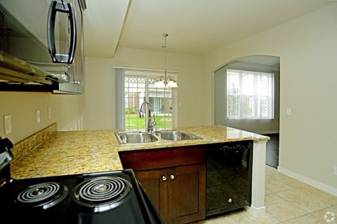 a kitchen with a sink and a counter top