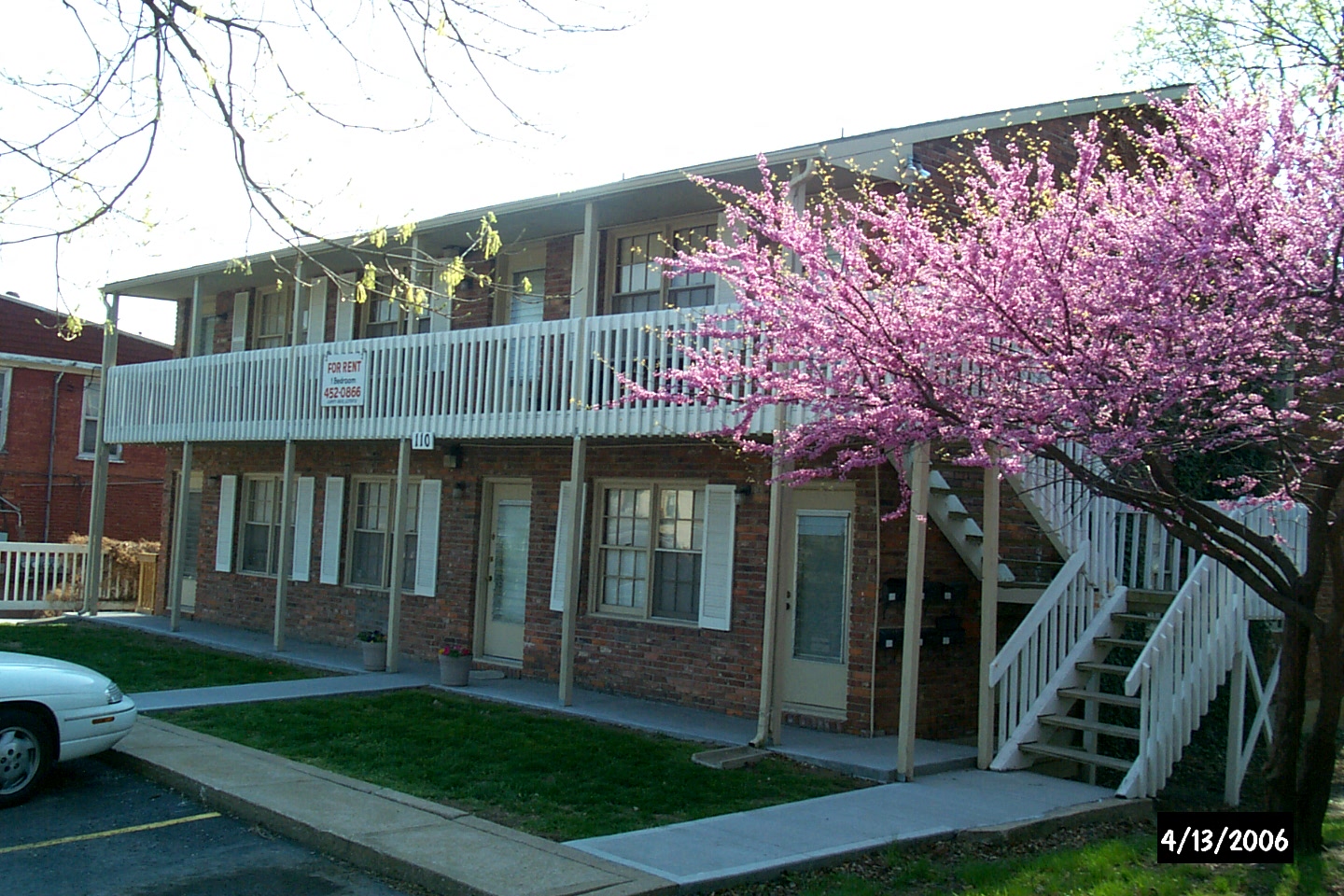 A building with a tree in front of it.