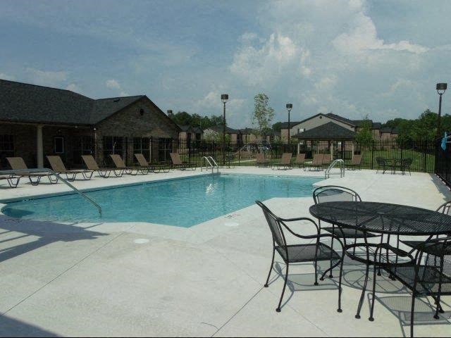 Pool With Relaxing Chairs at Heron Cove, Enterprise