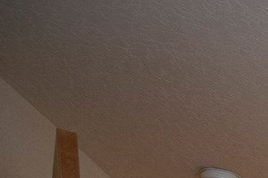 Interiors a bedroom with a large bed and a ceiling fan