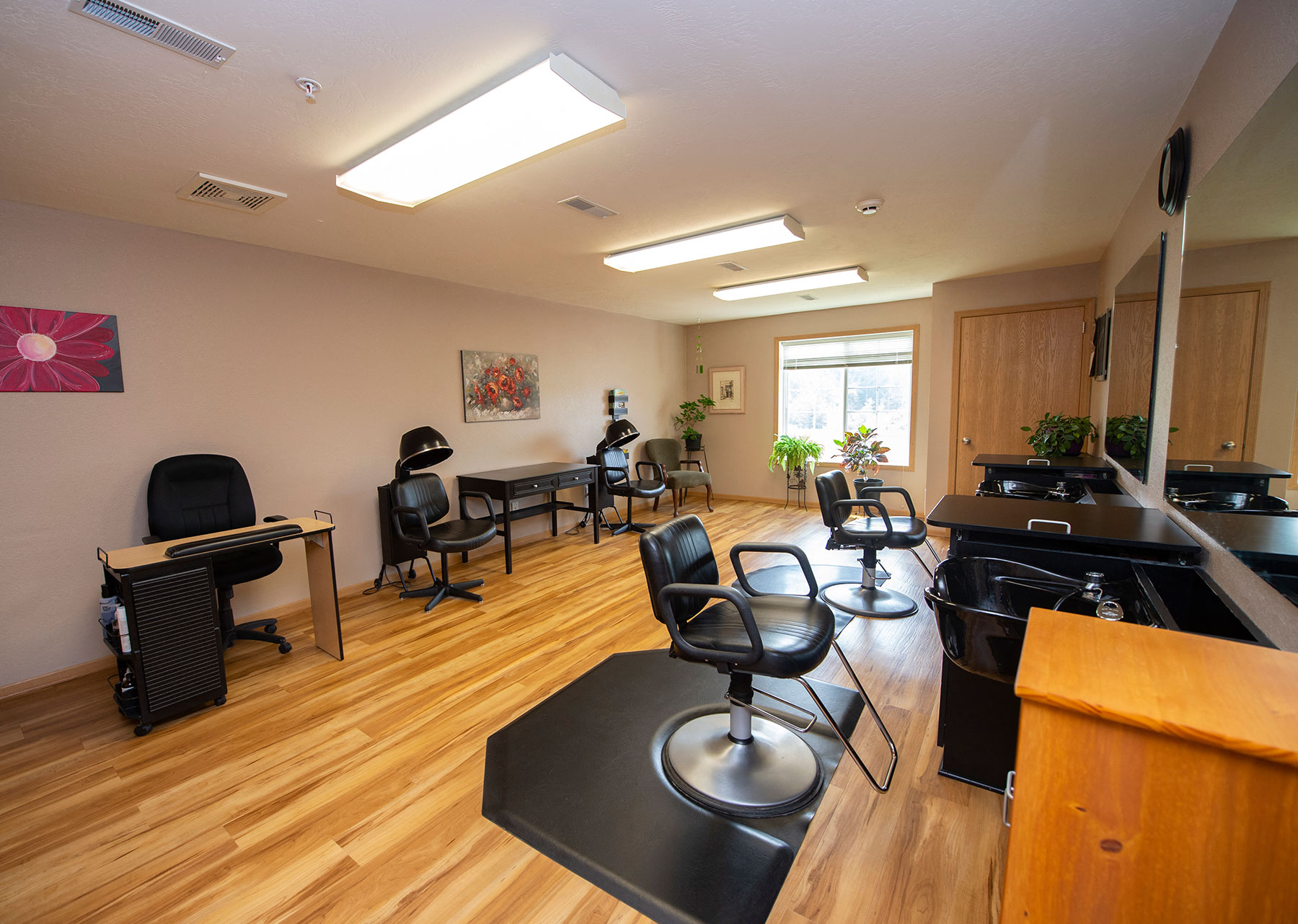 a salon room with chairs and tables and a piano