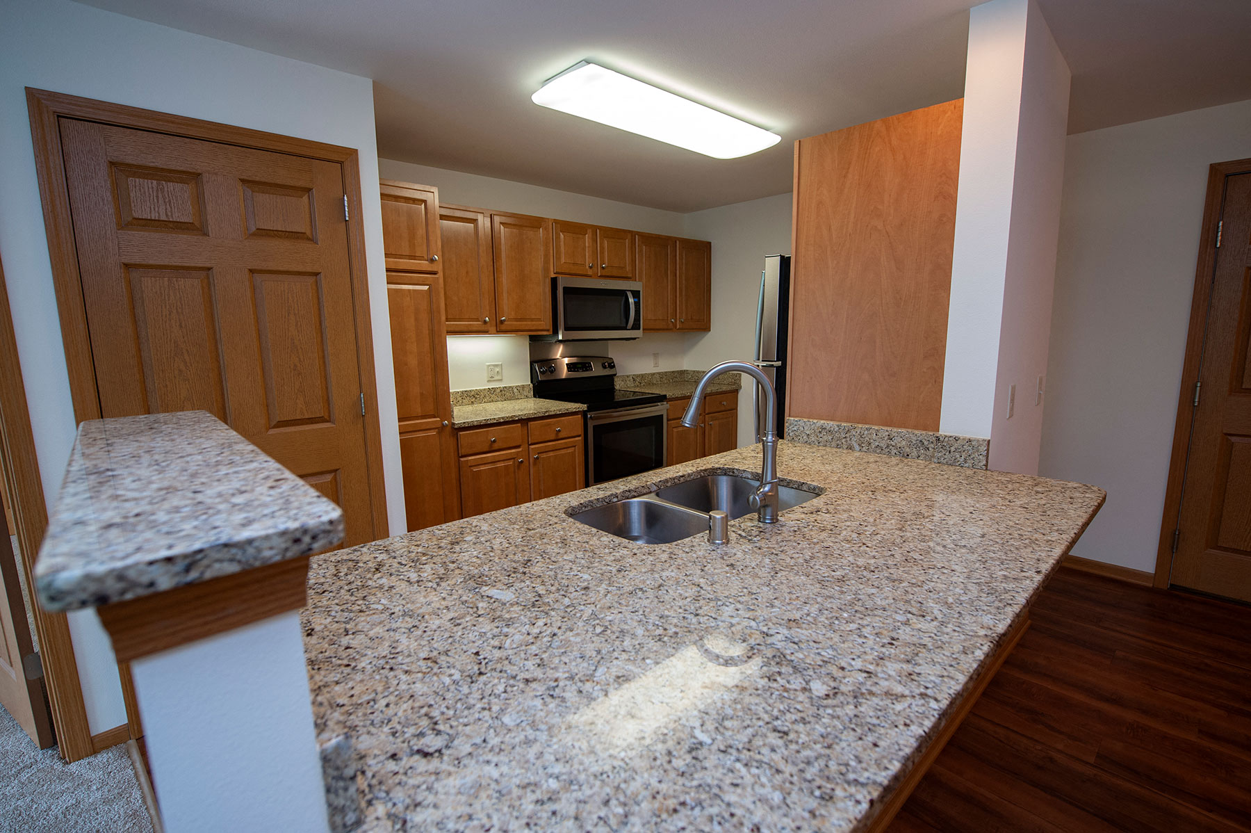 a kitchen with granite counter tops and a sink