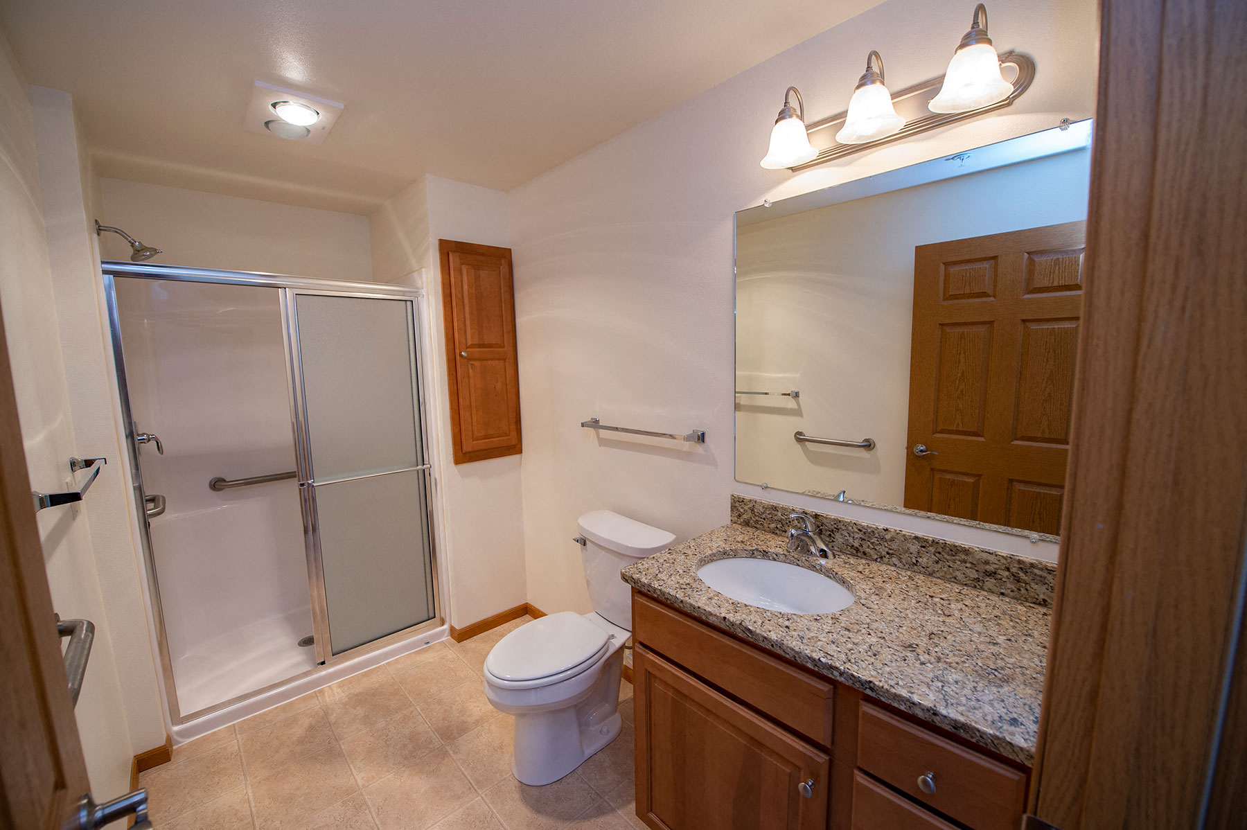 a bathroom with a sink toilet and a shower