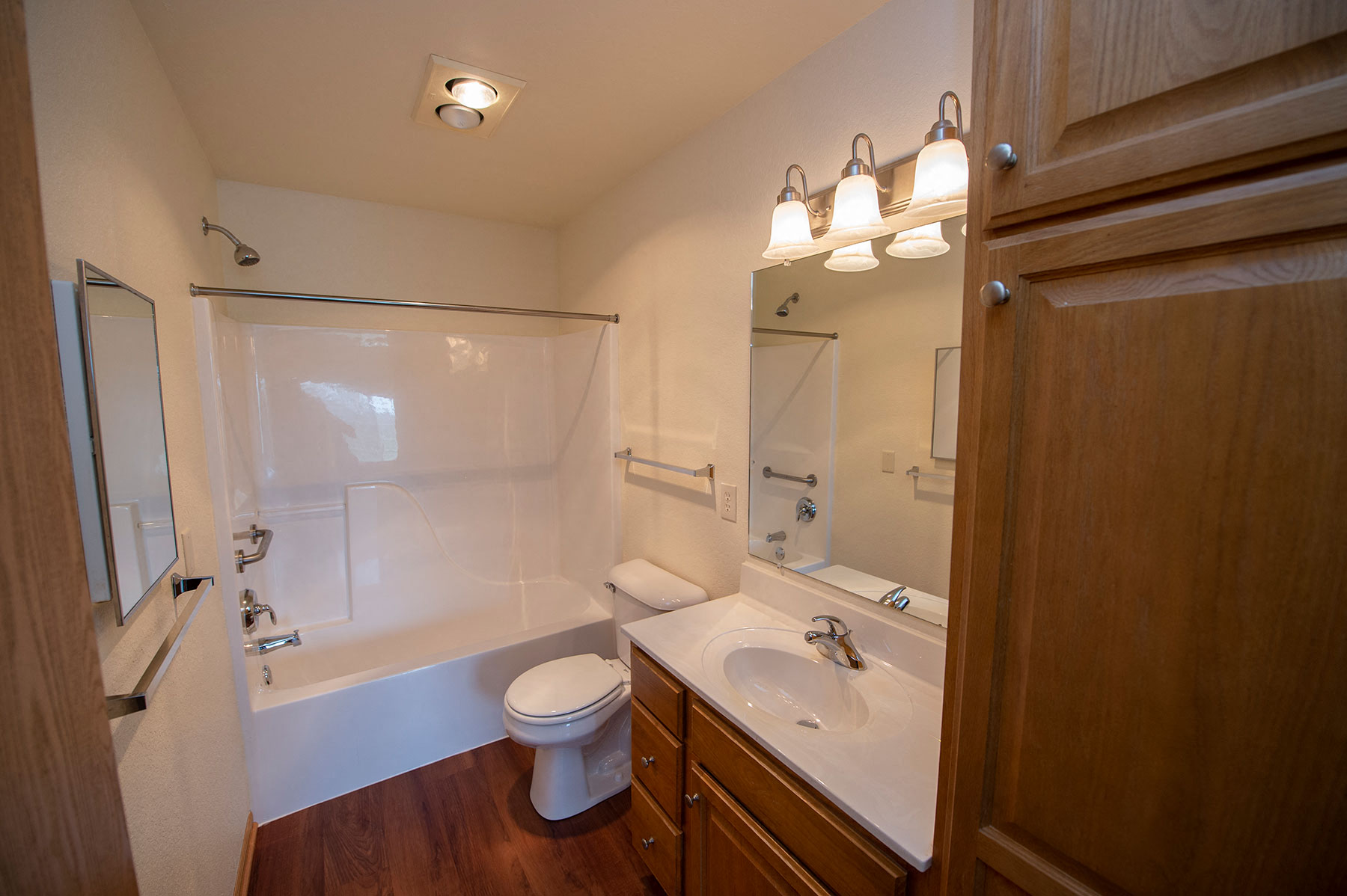 a bathroom with a sink toilet and bath tub